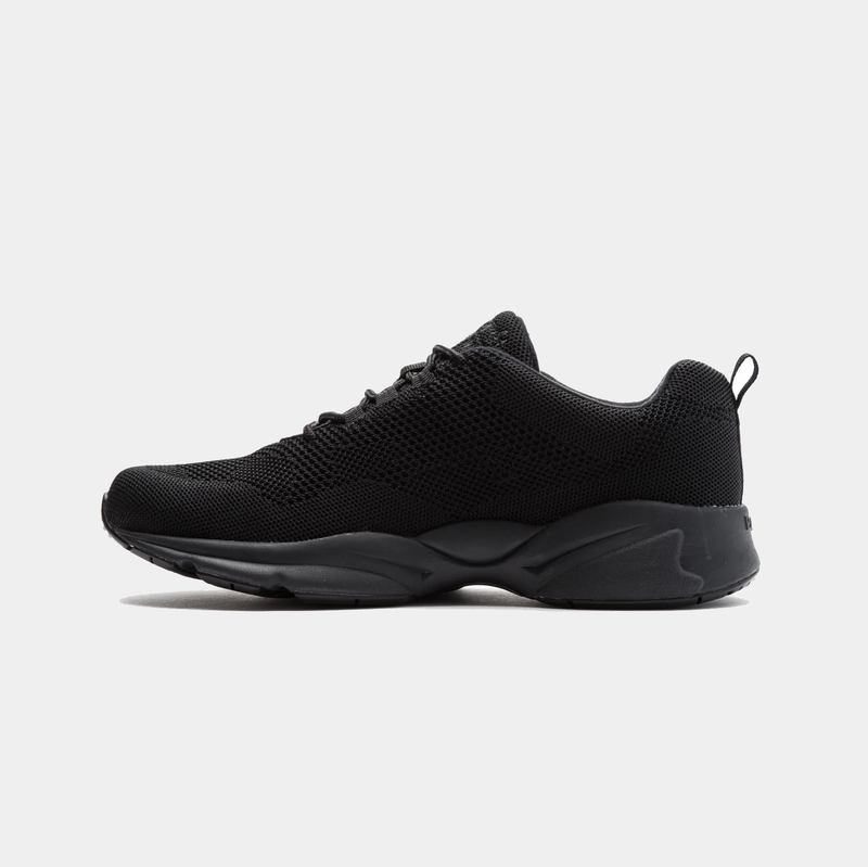 An all black sneaker with a knit mesh upper and a roomy toe box.