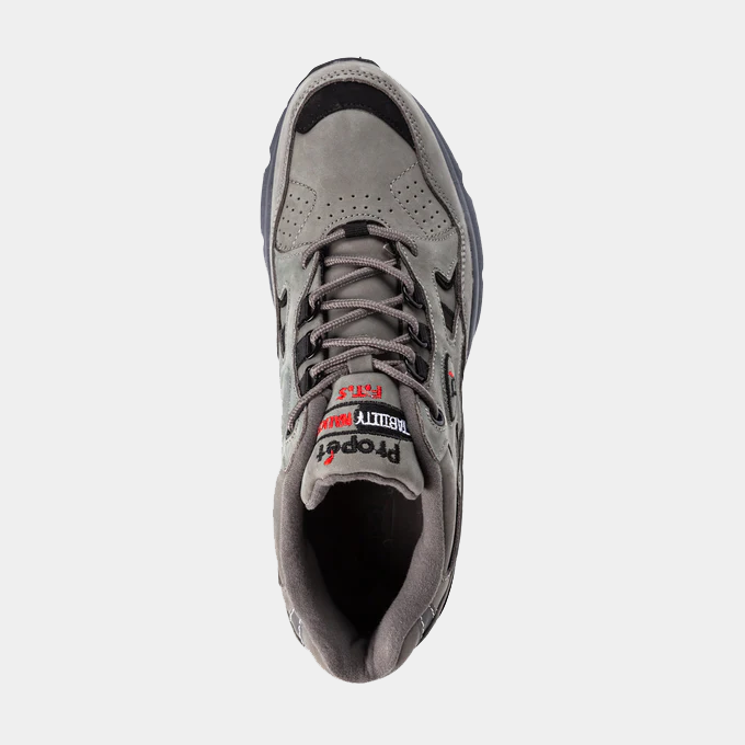Propét Stability Walker shoes in gray, featuring a suede upper with perforations and lace-up closure, top view.