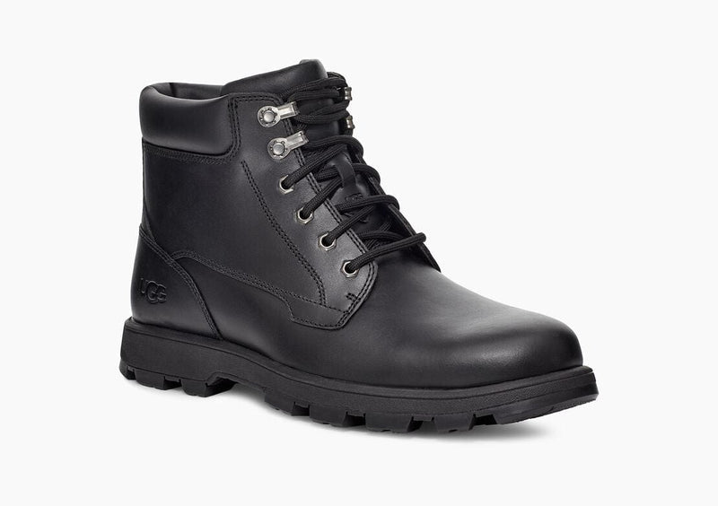 UGG Stenton boots in black leather with lace-up closure, metal eyelets, and treaded outsole, side angle view.