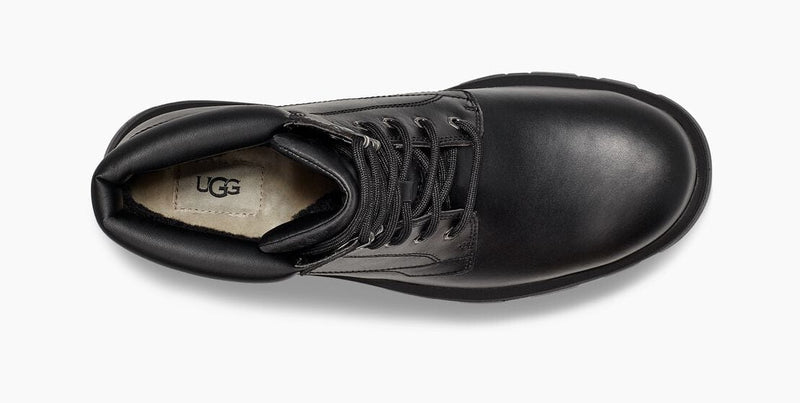 UGG Stenton boots in black leather with lace-up closure and plush interior lining, top view.