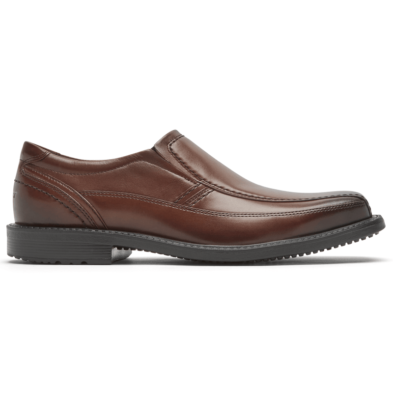 Rockport Style Leader 2 Bike Toe Slip-On dress shoes in brown leather with sleek stitching and slip-on design, side view.