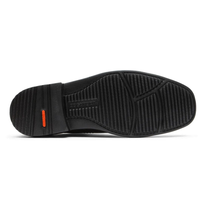 Rockport Style Leader 2 Plain Toe shoe outsole in black with textured grip and bold orange branding detail.