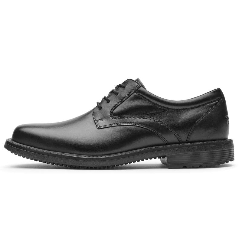 Rockport Style Leader 2 Plain Toe dress shoes in black leather with a sleek lace-up design, side view showing low heel and textured outsole.