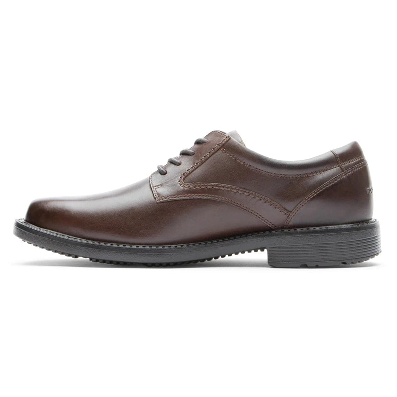 Rockport Style Leader 2 Plain Toe dress shoes in brown leather with smooth upper and lace-up closure, side view.
