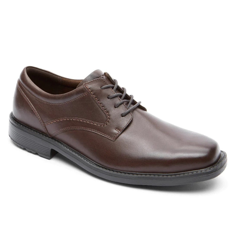 Rockport Style Leader 2 Plain Toe oxford shoes in dark brown leather with a lace-up closure and sleek plain toe design, side view.