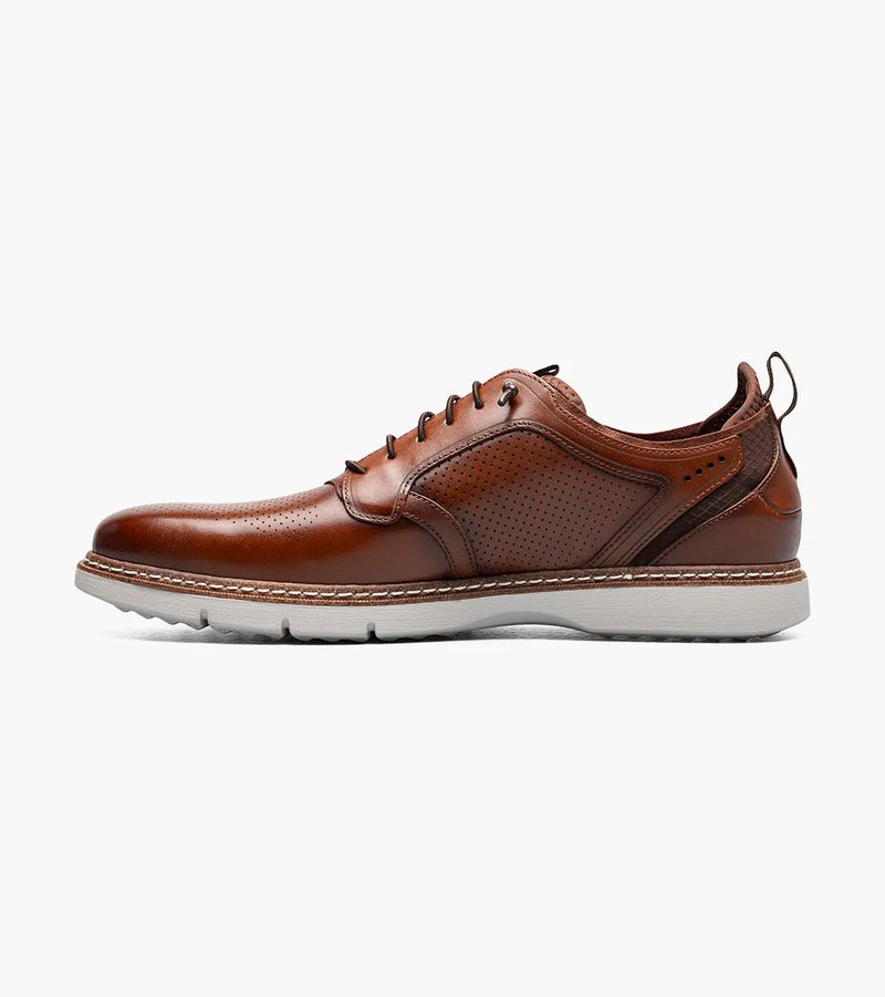 Stacy Adams Sync Plain Toe shoes in cognac with perforated leather upper, contrast stitching, and white rubber outsole, side view.