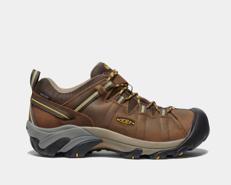 Keen Targhee II Waterproof hiking shoes, side view, brown leather upper with reinforced toe cap, yellow accents, and rugged outsole.