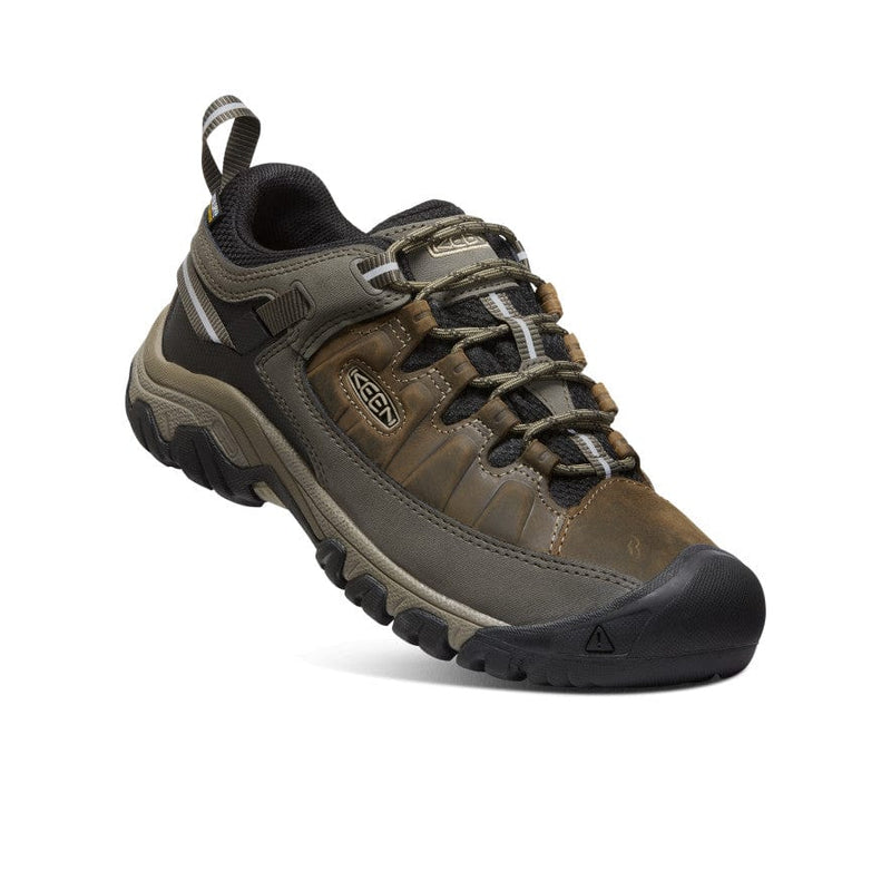 Keen Targhee III Waterproof hiking shoe in brown and olive with leather upper, reinforced toe cap, and rugged outsole, angled view.