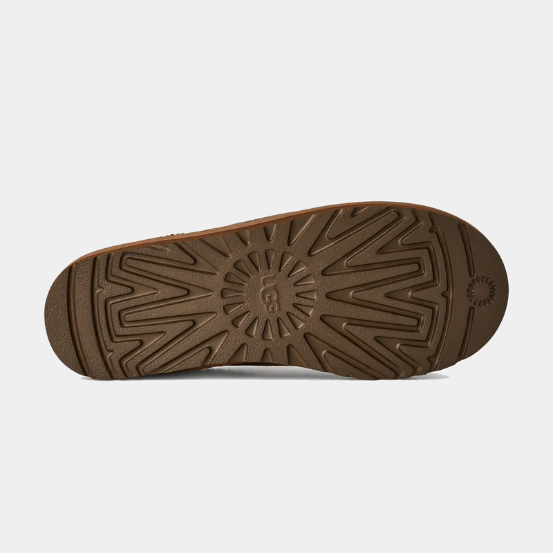 UGG Tasman Baxter sole view showing durable brown rubber outsole with textured tread pattern for traction.