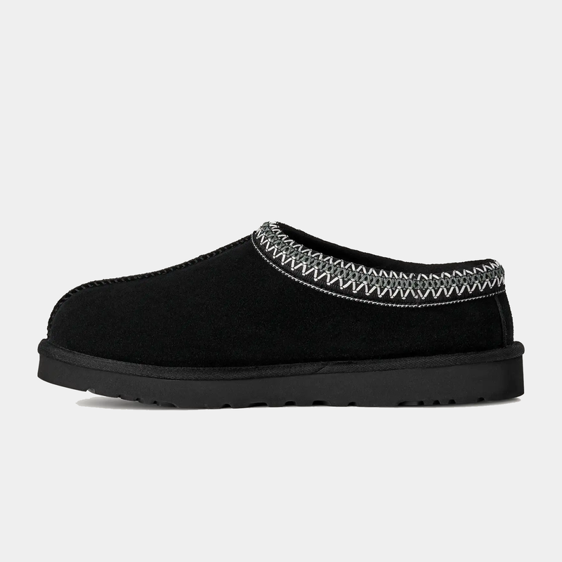 UGG Tasman II Slipper in black with suede upper, decorative woven trim, and Treadlite outsole, side view.