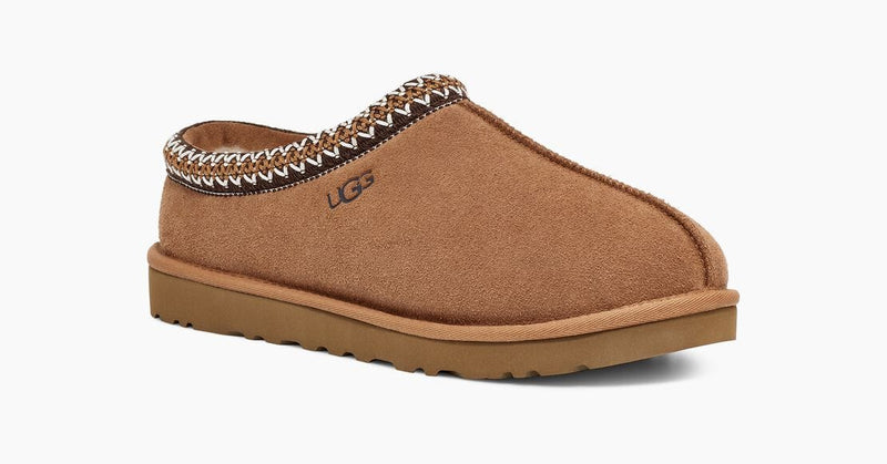 UGG Tasman Slipper in chestnut suede with embroidered detailing on the collar and a durable EVA outsole, side view.