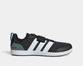Adidas THE TOTAL 2 training shoes, black textile upper with white stripes, teal heel detail, and lace-up with strap closure, side view.