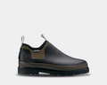 Bogs Tillamook Bay waterproof slip-on boots in black and olive green with durable rubber outsole, side view.