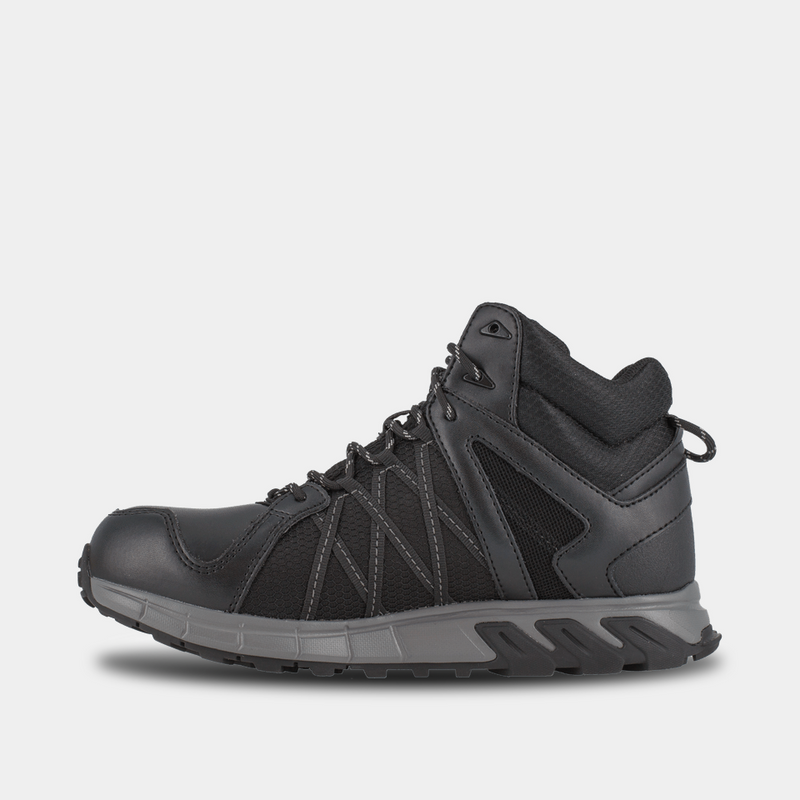 Reebok Work Trailgrip Work shoes in black with leather and mesh upper, rugged outsole, and padded collar, side view.