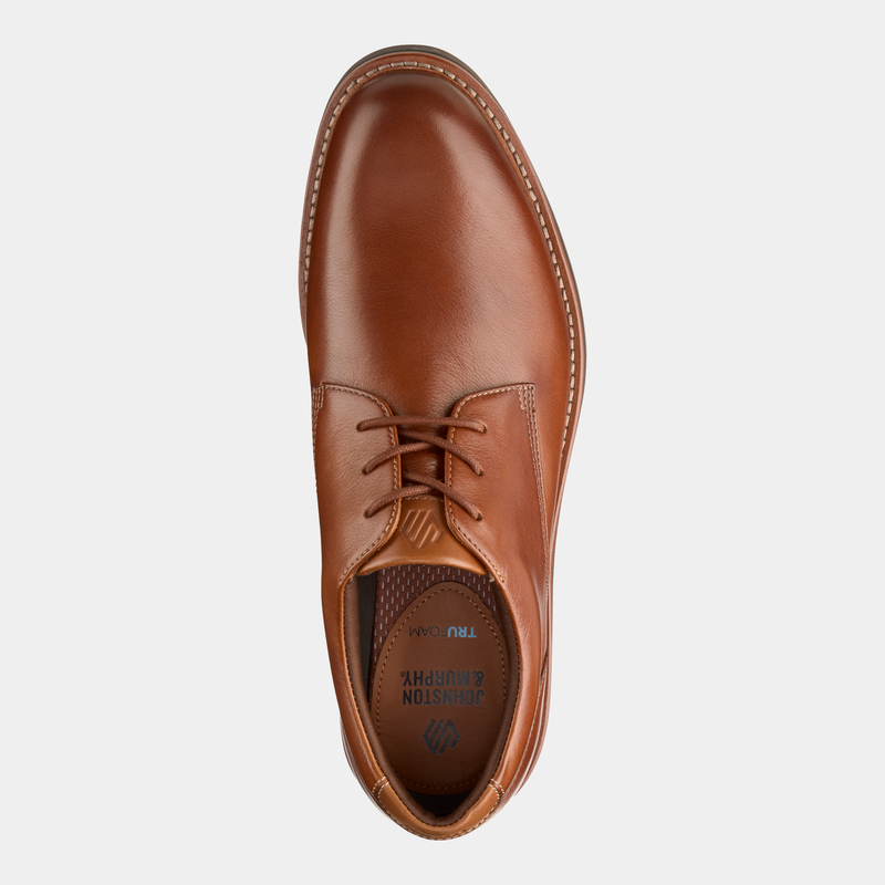 Johnston & Murphy Tyson Plain Toe dress shoe in polished tan leather with stitched detailing, top view showing lace-up closure and cushioned insole.
