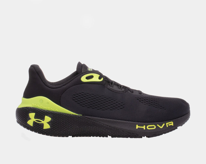 Under Armour UA HOVR™ Machina 3 running shoes in black with neon yellow accents, breathable mesh upper, side view.