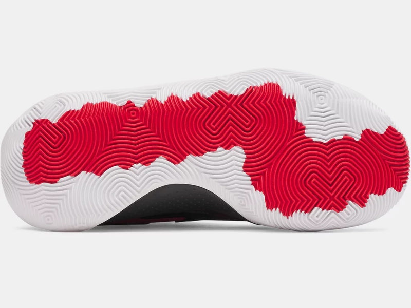 Under Armour UA Jet '25 basketball shoes outsole featuring circular traction pattern in white and red rubber, bottom view.
