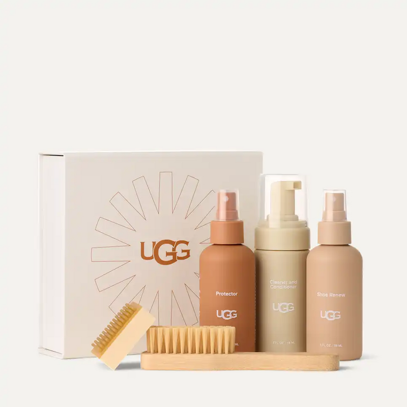 UGG Care Kit including Protector, Cleaner and Conditioner, Shoe Renew sprays, suede brush, and scuff eraser with branded packaging.