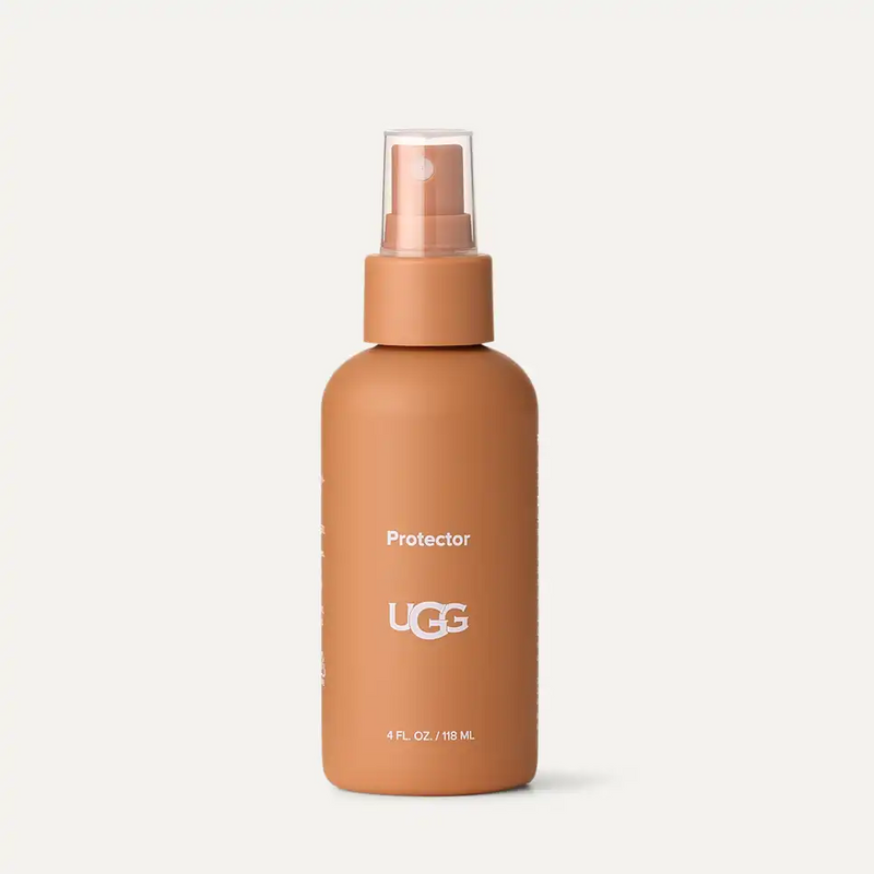 UGG Care Protector cleaning spray in a matte tan bottle with white branding, featuring a clear spray nozzle, front view.
