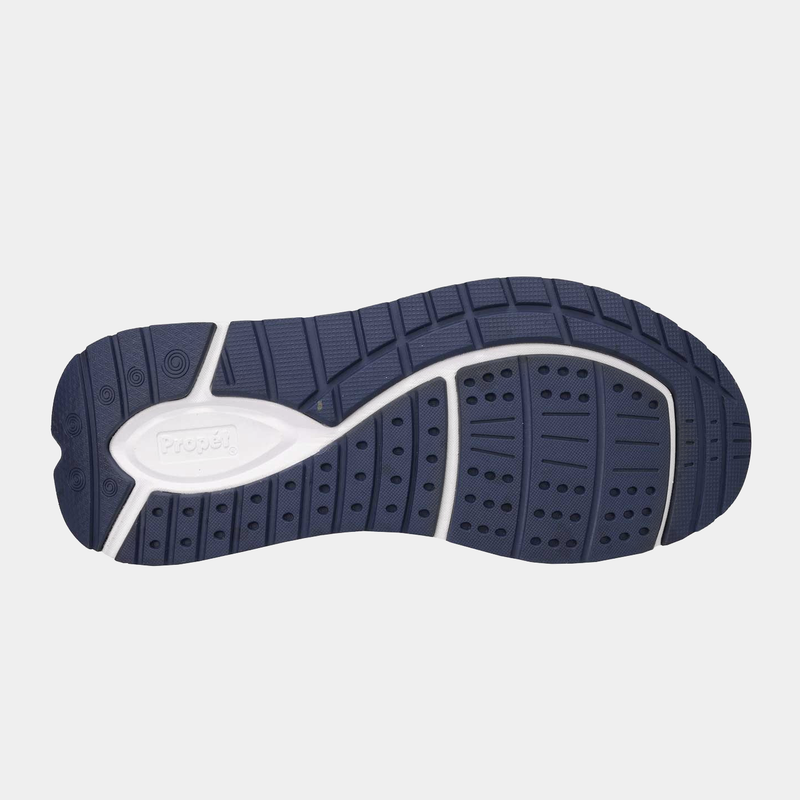 Propét Ultra 267 shoe sole with durable navy and white rubber, textured tread patterns, and flex grooves, bottom view.