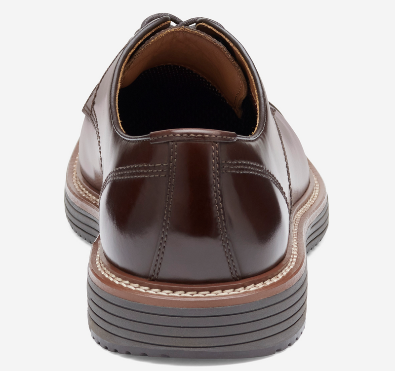 Johnston & Murphy Upton Cap Toe dress shoes in polished brown leather with stitched detailing and cushioned sole, back view.