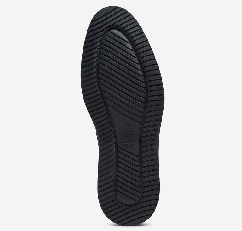 Johnston & Murphy Upton Cap Toe shoe outsole in black rubber with grooved tread pattern for traction, bottom view.