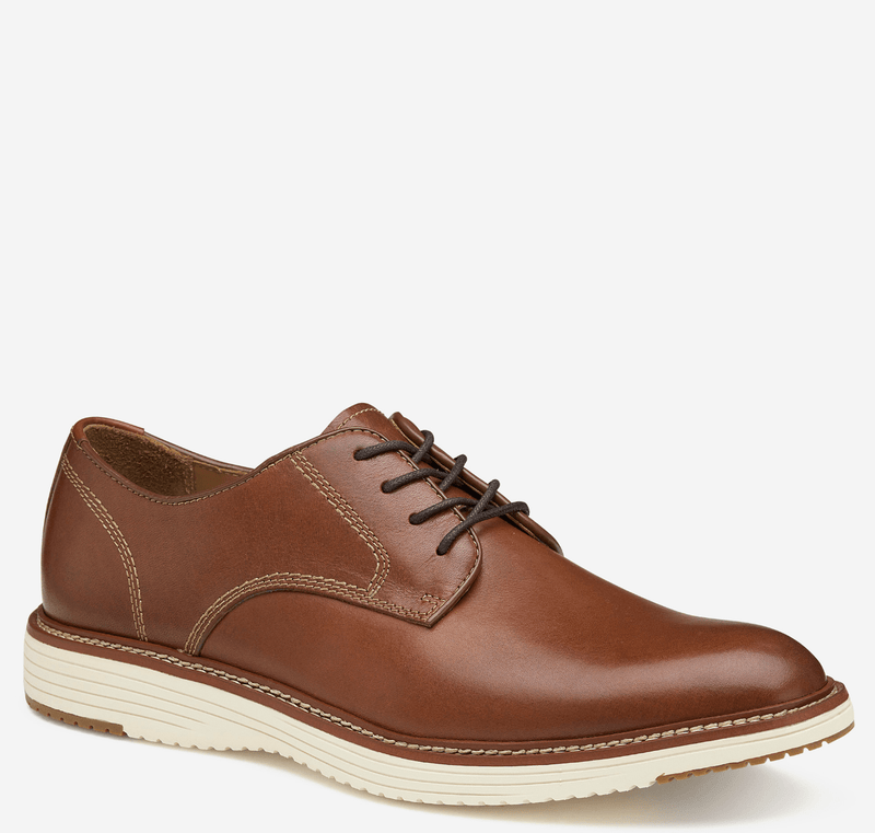 Johnston & Murphy Upton Plain Toe shoes in tan leather with contrast stitching and a white rubber sole, side angle view.