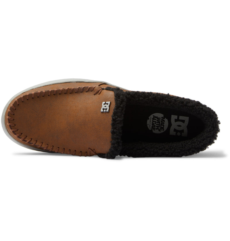 DC Footwear Villain 2 SE slip-on shoes in brown synthetic leather with moccasin-style stitching and black fleece lining, top view.
