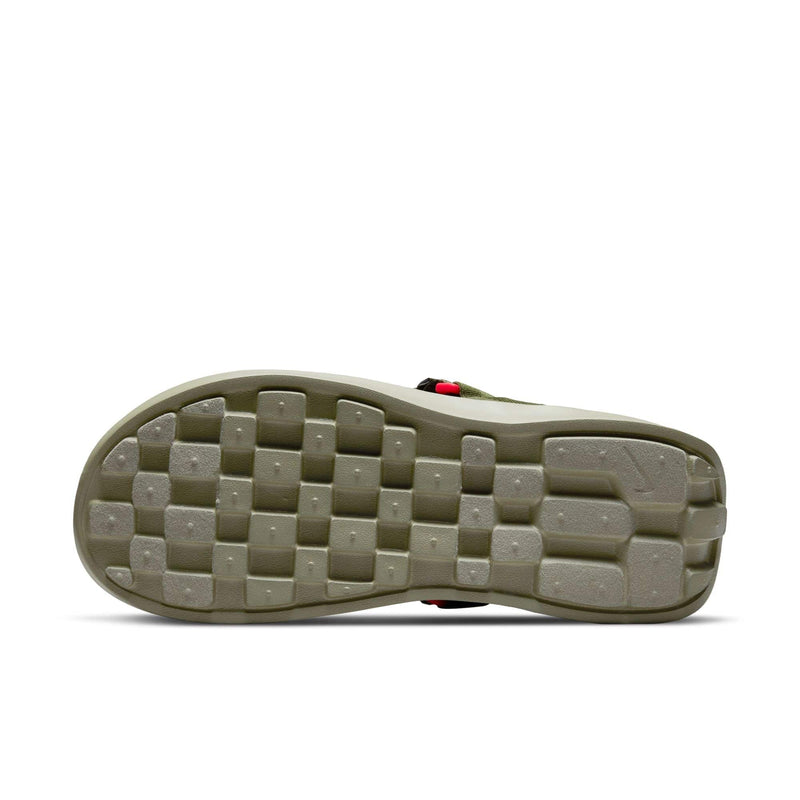 Nike Vista shoes outsole in olive green showing square grip pattern and durable rubber material, bottom view.
