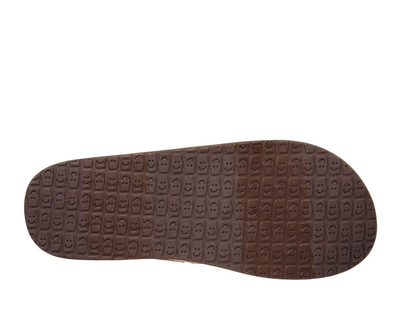 Sanuk You Got My Back III shoes outsole in brown rubber with engraved smiley face pattern.