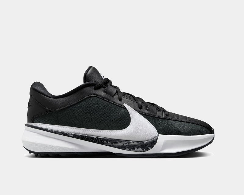 Nike Zoom Freak 5 basketball shoes in black and white with textured upper, oversized white Swoosh, and patterned midsole, side view.
