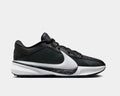 Nike Zoom Freak 5 basketball shoes in black and white with textured upper, oversized white Swoosh, and patterned midsole, side view.