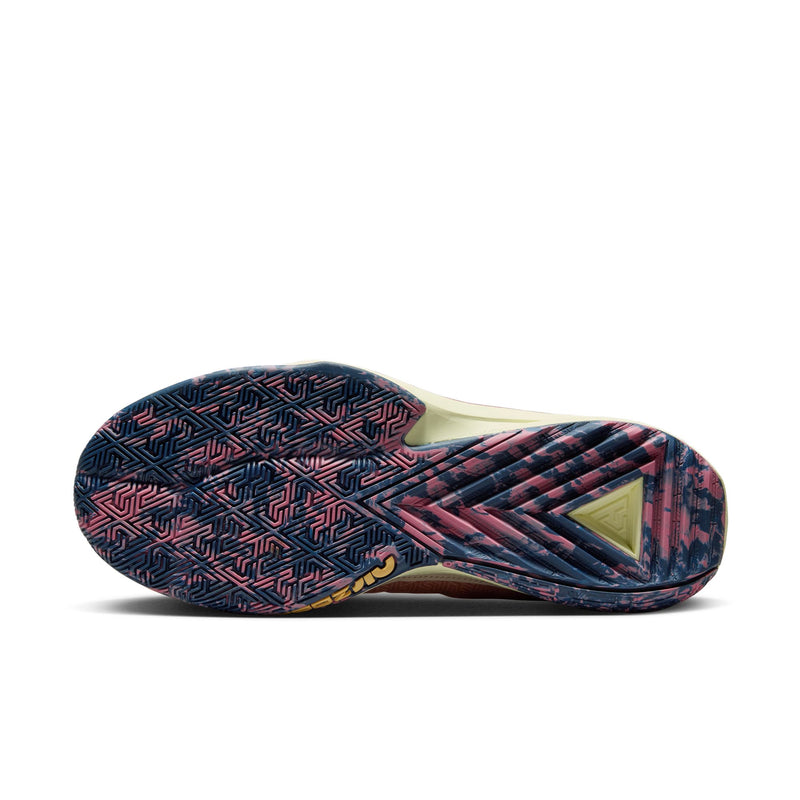 Nike Zoom Freak 5 basketball shoes outsole featuring vibrant pink and navy blue traction pattern with geometric details.