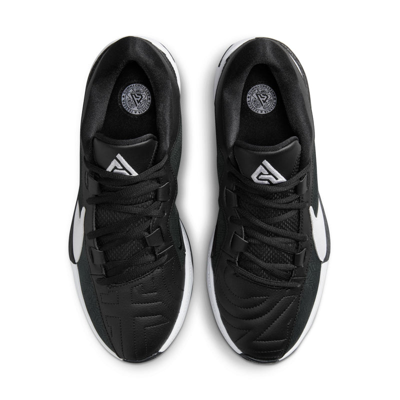 Nike Zoom Freak 5 basketball shoes in black with white accents, textured upper, and lace-up closure, top view.